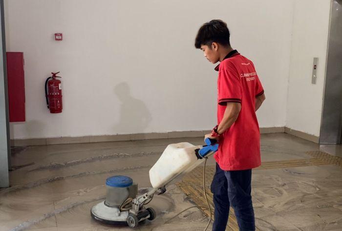 Ultra Cleaning specialist polishing a marble floor with a professional buffing machine
