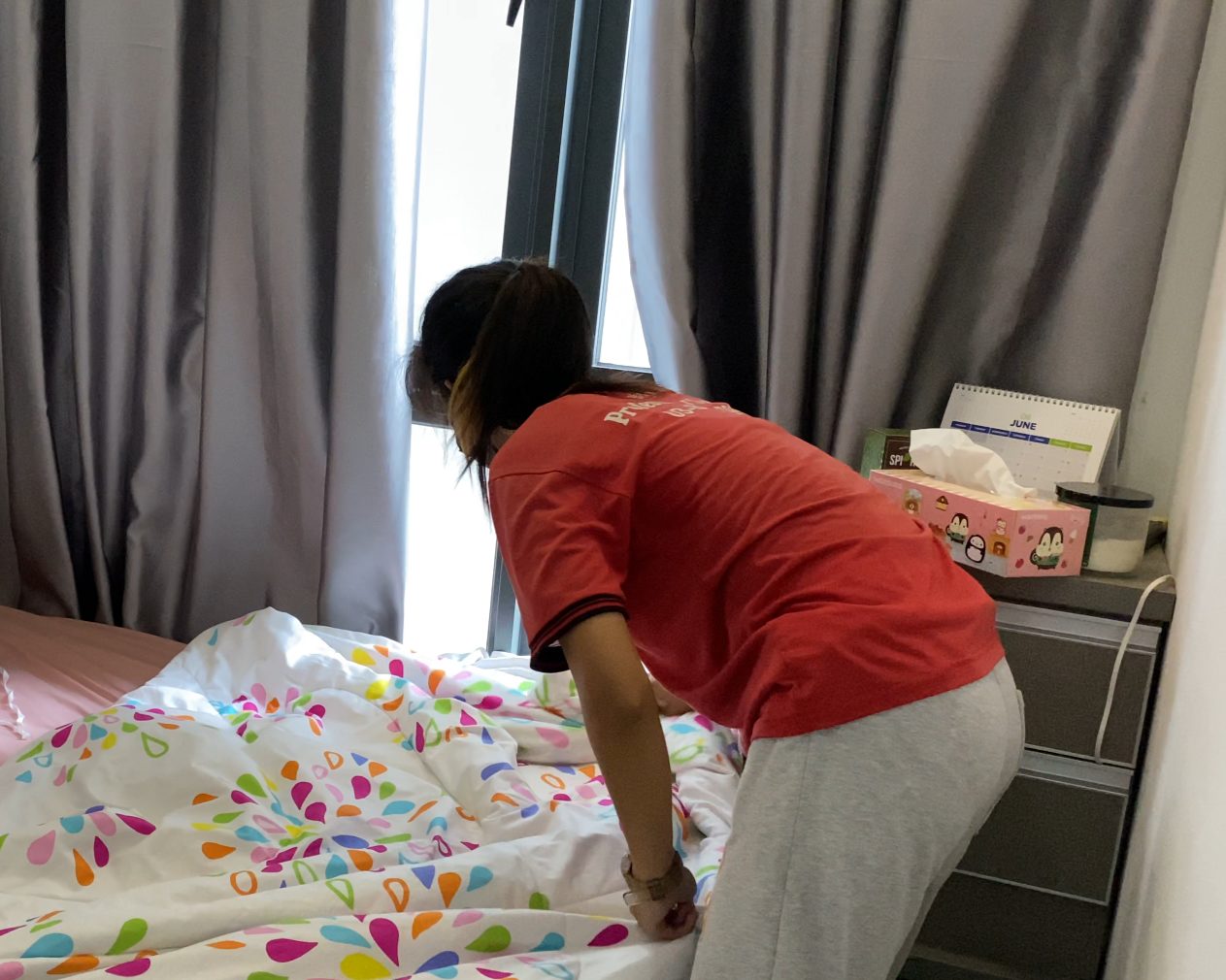Ultra Cleaning specialist making a bed in a Bangsar home