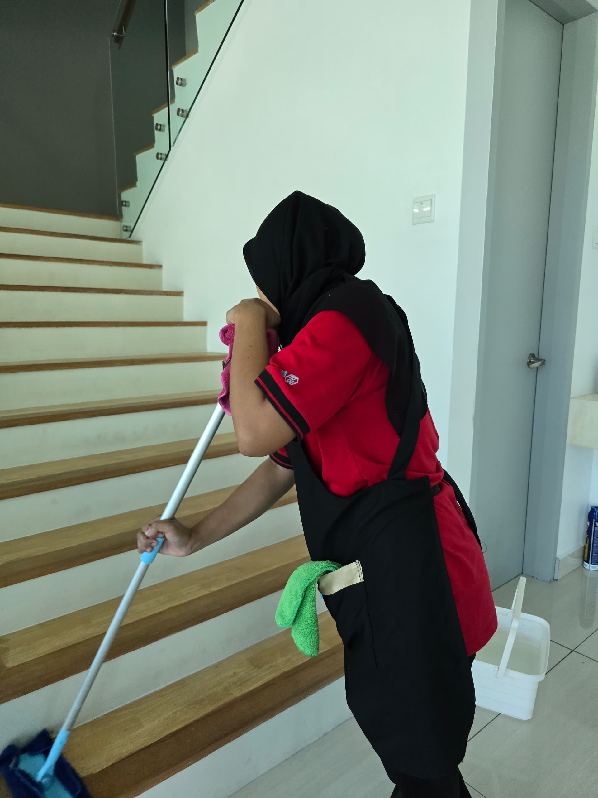 Ultra Cleaning specialist mopping a staircase